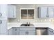 Recently remodeled kitchen featuring modern cabinetry, and a stainless steel dishwasher at 8014 W Mescal St, Peoria, AZ 85345