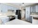 Spacious kitchen featuring plenty of storage, modern appliances, and updated countertops at 8014 W Mescal St, Peoria, AZ 85345
