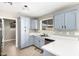 Bright kitchen showcasing modern appliances, a window, and stylish cabinetry at 8014 W Mescal St, Peoria, AZ 85345