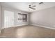 Light and airy living room featuring tile flooring, a ceiling fan, and a window with blinds at 8014 W Mescal St, Peoria, AZ 85345