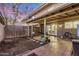 Charming backyard features a covered patio, brick pavers, and a small grassy area, ideal for outdoor enjoyment at 8226 N 32Nd Dr, Phoenix, AZ 85051