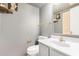 Stylish bathroom with gray walls, marble vanity, and gold hardware accents at 8226 N 32Nd Dr, Phoenix, AZ 85051