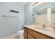 Well-lit bathroom with a vanity, toilet, and shower/tub combo, perfect for relaxation at 8226 N 32Nd Dr, Phoenix, AZ 85051