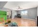 Spacious bonus room featuring hardwood floors, a ceiling fan, and ample natural light at 8226 N 32Nd Dr, Phoenix, AZ 85051