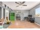 Spacious bonus room featuring hardwood floors, a ceiling fan, and ample natural light at 8226 N 32Nd Dr, Phoenix, AZ 85051