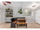 Dining room with a wooden table and bench seating, complemented by stylish decor and ample space at 8226 N 32Nd Dr, Phoenix, AZ 85051