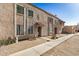 Townhome exterior showcasing an inviting walkway and a secure entry at 8226 N 32Nd Dr, Phoenix, AZ 85051