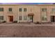 Charming townhome exterior features a red door and a textured facade at 8226 N 32Nd Dr, Phoenix, AZ 85051