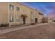 Townhome exterior shows desert landscaping and multiple windows at 8226 N 32Nd Dr, Phoenix, AZ 85051