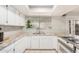 Bright kitchen featuring white cabinets, stainless steel appliances, sink and granite countertops at 8226 N 32Nd Dr, Phoenix, AZ 85051