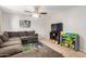 Bright living room featuring neutral walls, tile flooring, a comfy couch, and natural light at 8226 N 32Nd Dr, Phoenix, AZ 85051