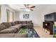 Bright living room featuring neutral walls, tile flooring, a comfy couch, and natural light at 8226 N 32Nd Dr, Phoenix, AZ 85051