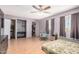Main bedroom with natural light, walk-in closet, and a cozy rocking chair at 8226 N 32Nd Dr, Phoenix, AZ 85051