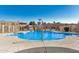 Community pool, surrounded by wrought iron fence and nearby residential buildings at 8226 N 32Nd Dr, Phoenix, AZ 85051