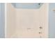 Clean white shower tub with recessed shelving and fixtures at 8226 N 32Nd Dr, Phoenix, AZ 85051
