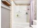 Cozy bathroom with tiled shower and toiletries shelf at 8226 N 32Nd Dr, Phoenix, AZ 85051