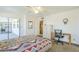 Bedroom with neutral walls and sliding door access to the outside, plus a study desk at 8320 E Nido Ave, Mesa, AZ 85209