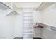 Well-organized walk-in closet with ample hanging space and shelving at 8320 E Nido Ave, Mesa, AZ 85209