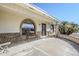Inviting covered front porch with seating area and decorative brickwork at 8320 E Nido Ave, Mesa, AZ 85209
