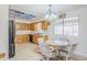 Bright kitchen with light wood cabinets, neutral countertops, and ample natural light at 8320 E Nido Ave, Mesa, AZ 85209