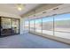 Screened-in patio that provides an airy feel with outdoor access and view into bedroom at 8320 E Nido Ave, Mesa, AZ 85209