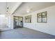 Bright sunroom featuring white brick, neutral carpet and windows overlooking the landscaped backyard at 8320 E Nido Ave, Mesa, AZ 85209