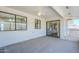 Neutral sunroom with white brick walls, windows, and glass doors leading to other rooms of the home at 8320 E Nido Ave, Mesa, AZ 85209