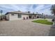 The backyard features a covered patio, gravel landscaping, playground, and small patch of green grass at 903 W Barrow Dr, Chandler, AZ 85225