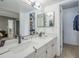 Bright bathroom with marble counters, double sinks, and modern fixtures at 903 W Barrow Dr, Chandler, AZ 85225