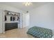 Bright bedroom featuring a closet with clothes, a ceiling fan, and light-colored hardwood floors at 903 W Barrow Dr, Chandler, AZ 85225