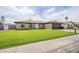 Charming brick home with a lush green lawn, two-car garage, and a welcoming front entrance at 903 W Barrow Dr, Chandler, AZ 85225