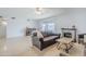 Open living room with natural light, a brick fireplace, and access to the backyard at 903 W Barrow Dr, Chandler, AZ 85225
