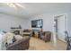 Cozy living room features modern furniture, a fireplace, and a flat screen television at 903 W Barrow Dr, Chandler, AZ 85225