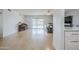 Bright, open-concept living room with hardwood floors, a sliding door, and neutral decor at 903 W Barrow Dr, Chandler, AZ 85225