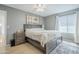 Cozy main bedroom featuring neutral walls, light-colored hardwood floors, and lots of light at 903 W Barrow Dr, Chandler, AZ 85225