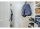 Spacious walk-in closet with built-in shelves, hanging rods, and ample storage space for clothes and accessories at 903 W Barrow Dr, Chandler, AZ 85225