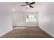 Bright bedroom featuring plush carpet, a ceiling fan, and a window for natural light at 907 W Laguna Dr, Tempe, AZ 85282