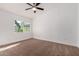 Minimalist bedroom with carpeted floors, a ceiling fan, and a window to let in natural light at 907 W Laguna Dr, Tempe, AZ 85282