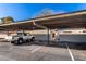 Assigned covered parking carport with space number featured on the side support beams at 907 W Laguna Dr, Tempe, AZ 85282