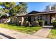 Lovely home exterior with lush lawn and decorative brickwork at 907 W Laguna Dr, Tempe, AZ 85282