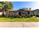 Attractive exterior showcasing the front yard and brick accents at 907 W Laguna Dr, Tempe, AZ 85282