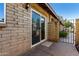 Exterior sliding glass door leading to the outdoor patio and garden at 907 W Laguna Dr, Tempe, AZ 85282