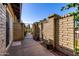 Outdoor patio area with brick walls and a view of the gate at 907 W Laguna Dr, Tempe, AZ 85282