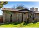 Image of home showing the lawn, brick facade, and well-kept garden at 907 W Laguna Dr, Tempe, AZ 85282