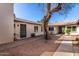 Exterior view of the property with mature shade tree in common courtyard area at 907 W Laguna Dr, Tempe, AZ 85282