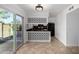 Kitchen with tile flooring and sliding glass doors, offers functionality and access to the outdoors at 907 W Laguna Dr, Tempe, AZ 85282