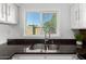 Updated kitchen with granite countertops, stainless steel appliances, and bright natural light at 907 W Laguna Dr, Tempe, AZ 85282