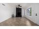 Bright living room with tile flooring, a modern fireplace, and a large window offering natural light at 907 W Laguna Dr, Tempe, AZ 85282