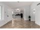 Spacious living room with tile floors and open layout to the kitchen at 907 W Laguna Dr, Tempe, AZ 85282