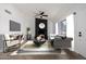 This open living room features a modern fireplace and large windows for natural light at 907 W Laguna Dr, Tempe, AZ 85282
